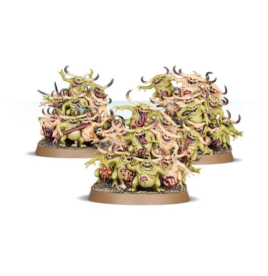 Three piles of fantasy miniatures with green and beige colors on a white background